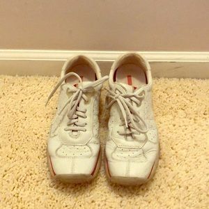 Prada white sneakers with red trim